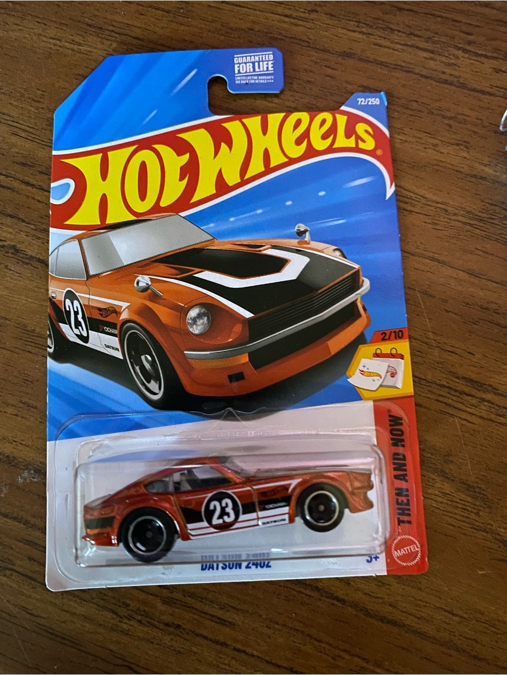 How wheel Datsun 24oz 1:64 diecast orange car then and now unopened box 2025